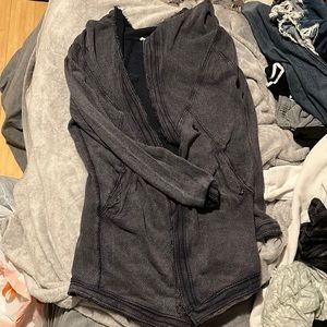 Sundance cardigan. Its dark blue with a hint of purple. In great condition.